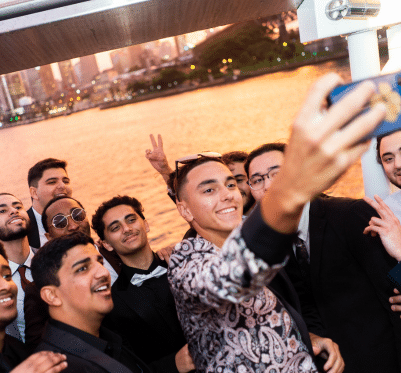 Group enjoying a sunset cruise on the deck of a Pyrmont boat.