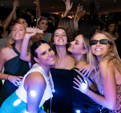 Group of friends enjoying a vibrant nightlife experience on a Pyrmont cruise