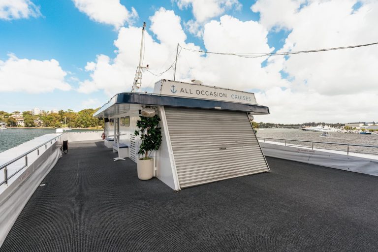Cruise deck of Pyrmont-based All Occasion Cruises under a bright blue sky.